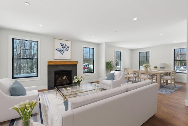 11 Acorn Ave, Kennebunkport, ME 04046 - living room featuring recessed lighting, a fireplace with flush hearth, wood finished floors, and baseboards