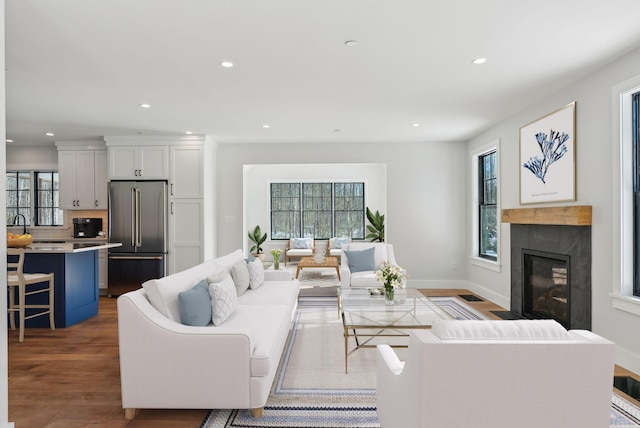 11 Acorn Ave, Kennebunkport, ME 04046 - living area featuring plenty of natural light, recessed lighting, wood finished floors, and a fireplace with flush hearth