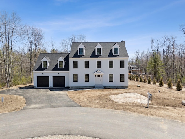 11 Acorn Ave, Kennebunkport, ME 04046 - view of front facade with asphalt driveway and a chimney