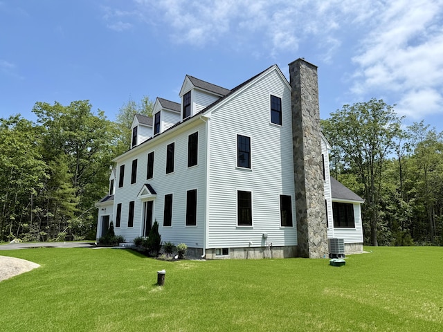 11 Acorn Ave, Kennebunkport, ME 04046 - view of home's exterior featuring a yard and a chimney