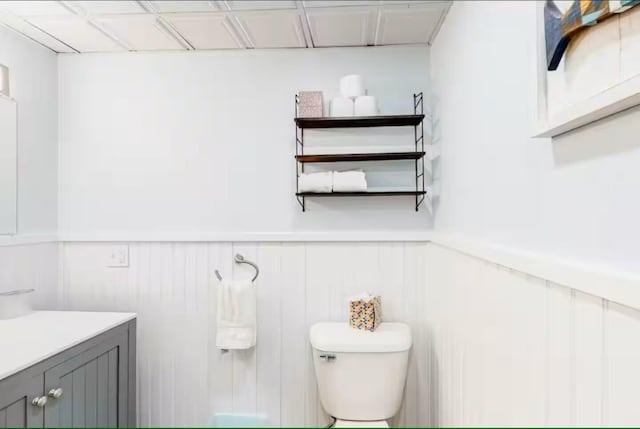 597 Sweden Rd, Bridgton, ME 04009 - bathroom featuring wainscoting, toilet, and vanity