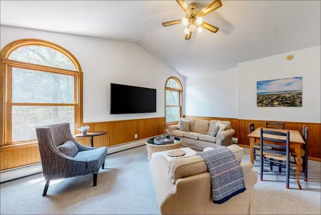 597 Sweden Rd, Bridgton, ME 04009 - living area featuring carpet, ceiling fan, healthy amount of natural light, a wainscoted wall, and vaulted ceiling