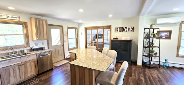 kitchen with dishwasher, a sink, a wall mounted AC, a kitchen breakfast bar, and dark wood-type flooring