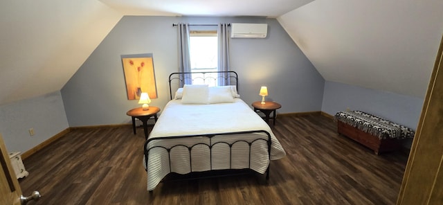 bedroom featuring an AC wall unit, wood finished floors, vaulted ceiling, and baseboards
