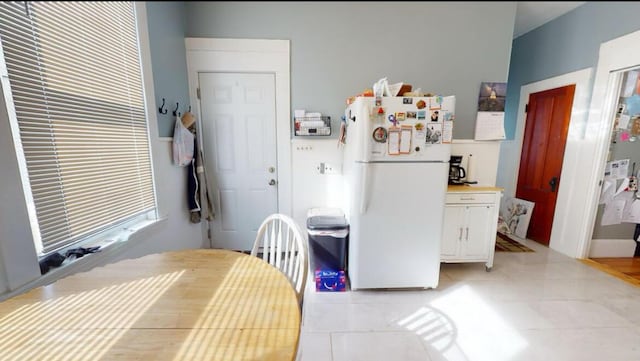 dining area featuring light tile patterned floors