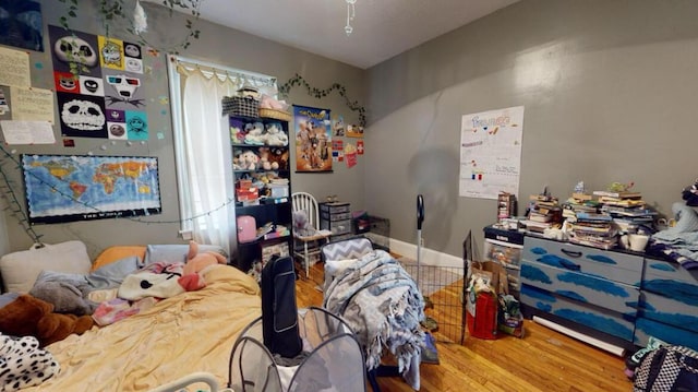 bedroom featuring wood finished floors