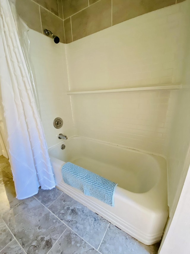 bathroom with shower / tub combo