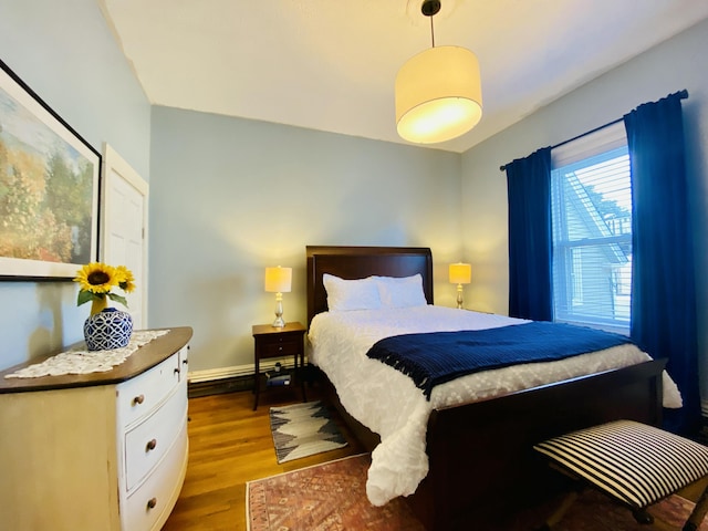 bedroom featuring dark wood-style flooring