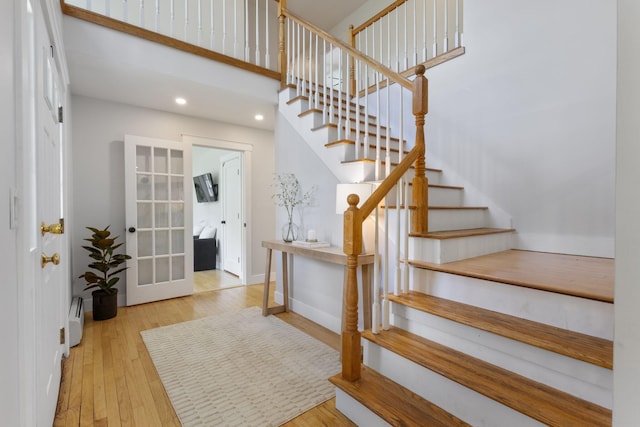11 Oxford Rd, Windham, ME 04062 - foyer featuring stairway, baseboard heating, wood finished floors, recessed lighting, and french doors