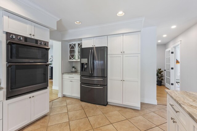 11 Oxford Rd, Windham, ME 04062 - kitchen featuring stainless steel fridge with ice dispenser, double oven, recessed lighting, white cabinets, and light tile patterned flooring