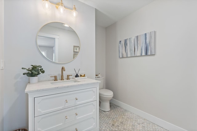 11 Oxford Rd, Windham, ME 04062 - bathroom with vanity, toilet, baseboards, and tile patterned floors