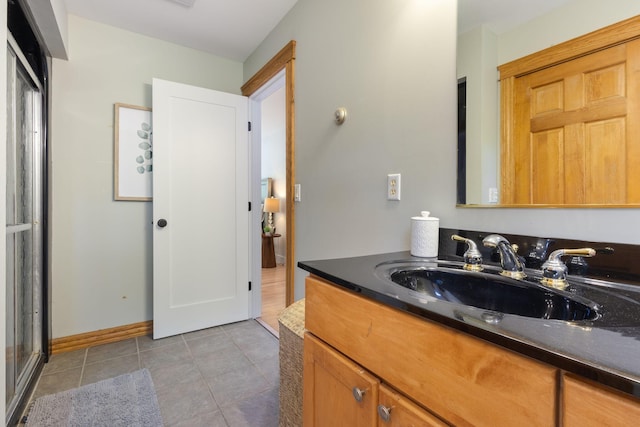 11 Oxford Rd, Windham, ME 04062 - full bathroom with vanity, tile patterned flooring, and baseboards