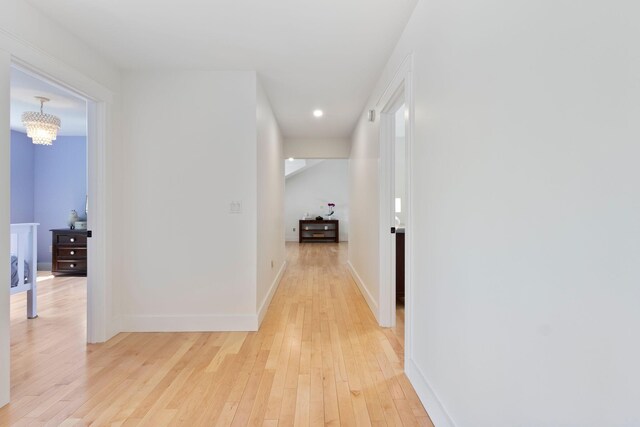 11 Oxford Rd, Windham, ME 04062 - hall with light wood finished floors, baseboards, a chandelier, and recessed lighting
