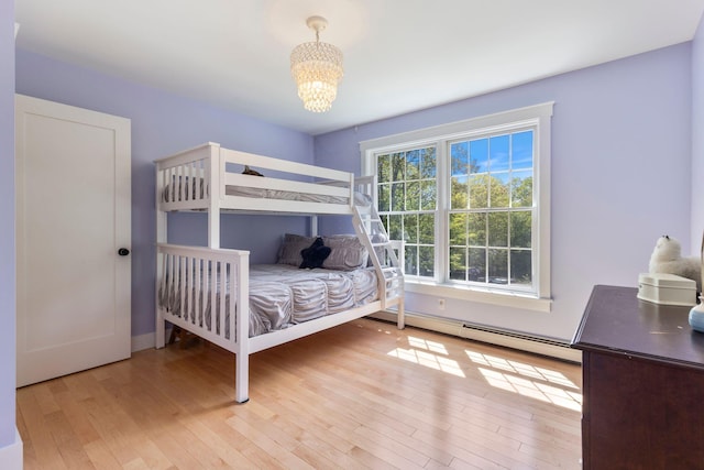11 Oxford Rd, Windham, ME 04062 - bedroom featuring a chandelier, hardwood / wood-style flooring, and a baseboard radiator