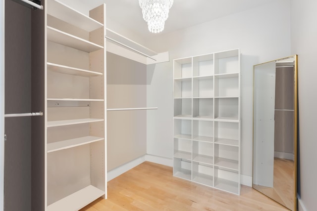 11 Oxford Rd, Windham, ME 04062 - spacious closet with wood finished floors and a chandelier