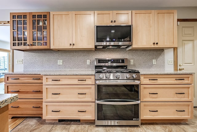 1 Mayflower Way, Norway, ME 04268 - kitchen with light brown cabinets, appliances with stainless steel finishes, glass insert cabinets, and tasteful backsplash