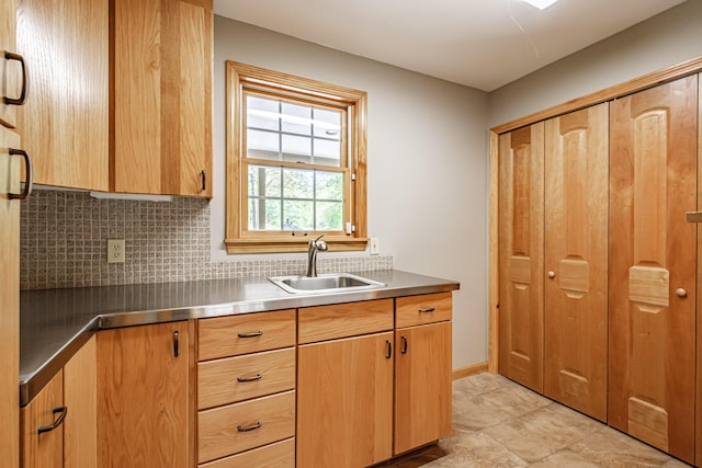 1 Mayflower Way, Norway, ME 04268 - kitchen with stainless steel counters, a sink, and decorative backsplash
