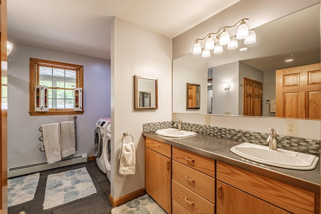 1 Mayflower Way, Norway, ME 04268 - full bathroom with independent washer and dryer, a baseboard radiator, baseboards, double vanity, and wood finished floors