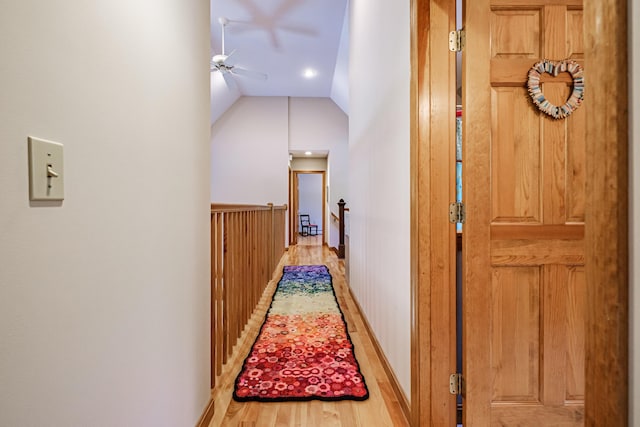 1 Mayflower Way, Norway, ME 04268 - corridor featuring wood finished floors, an upstairs landing, vaulted ceiling, and baseboards