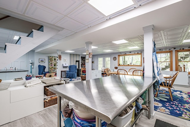 1 Mayflower Way, Norway, ME 04268 - kitchen with stainless steel countertops, light wood-type flooring, plenty of natural light, and decorative columns