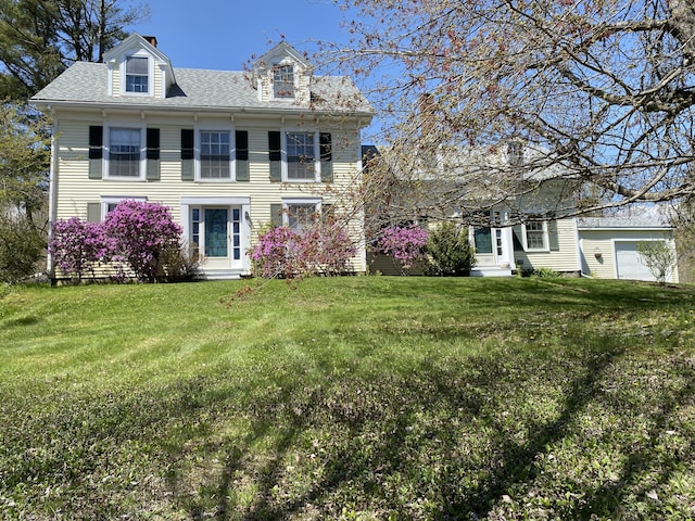 12 Old Rte 1, Searsport, ME 04974 - view of front of house with a front lawn, a shingled roof, and a chimney
