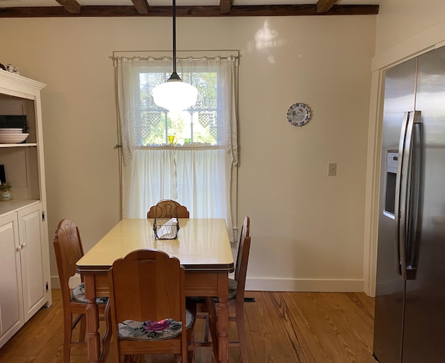 12 Old Rte 1, Searsport, ME 04974 - dining room with wood finished floors, beam ceiling, and baseboards