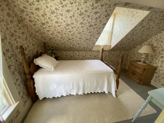 12 Old Rte 1, Searsport, ME 04974 - bedroom with wallpapered walls, baseboards, and lofted ceiling
