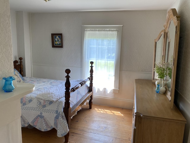 12 Old Rte 1, Searsport, ME 04974 - bedroom featuring multiple windows, light wood-type flooring, and baseboards