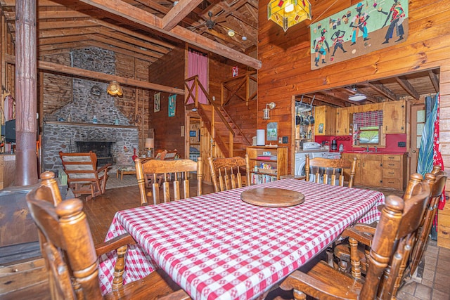 106 Shady Ln, Parsonsfield, ME 04047 - dining space featuring wooden walls, high vaulted ceiling, stairway, and a fireplace