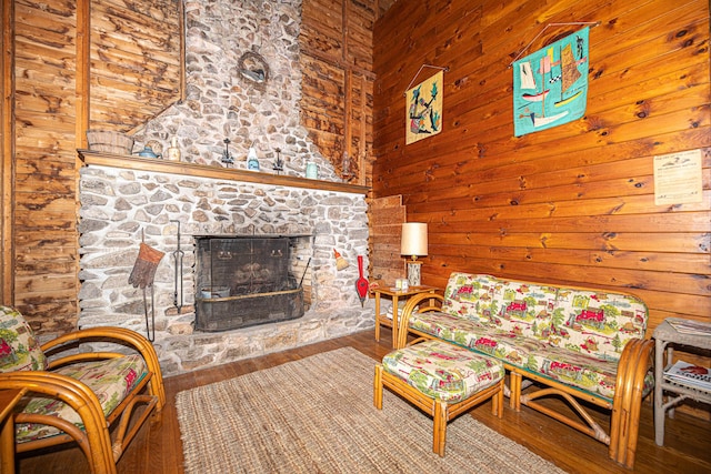 106 Shady Ln, Parsonsfield, ME 04047 - living area with a stone fireplace, wooden walls, and wood finished floors