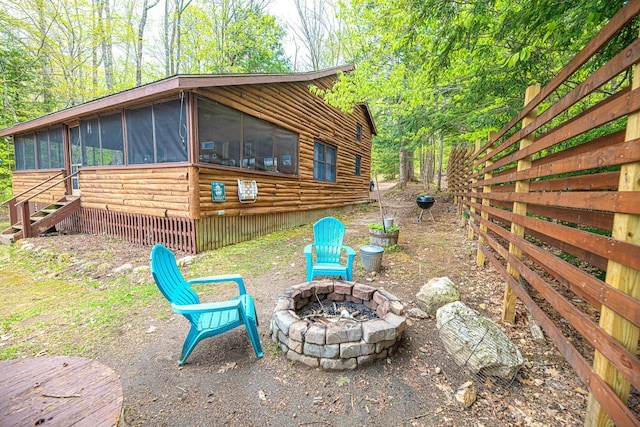 106 Shady Ln, Parsonsfield, ME 04047 - view of home's exterior featuring an outdoor fire pit and a sunroom