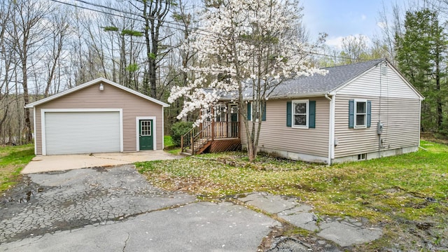 227 Forest Ave, Orono, ME 04473 - view of front of property featuring a garage, an outbuilding, and roof with shingles