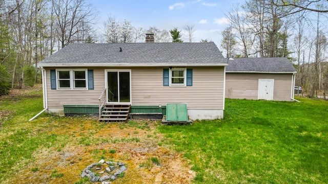 227 Forest Ave, Orono, ME 04473 - back of property featuring a chimney, a lawn, entry steps, and roof with shingles