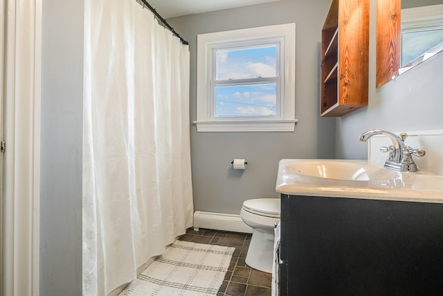 bathroom featuring baseboard heating, baseboards, toilet, and vanity