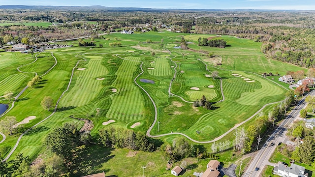 view of property location featuring a large body of water and a golf course