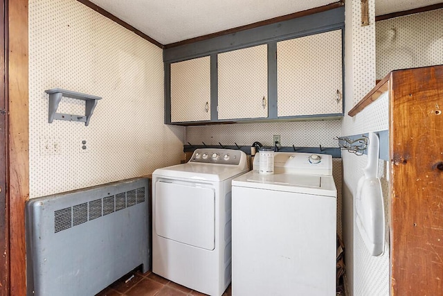 laundry room with radiator heating unit, wallpapered walls, cabinet space, washing machine and dryer, and ornamental molding