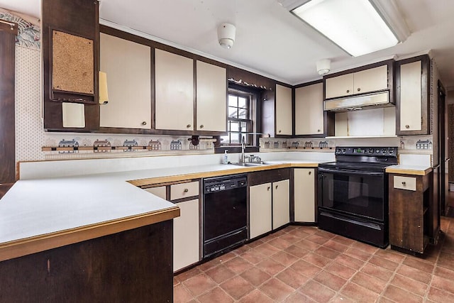 kitchen with black appliances, a sink, light countertops, under cabinet range hood, and a peninsula