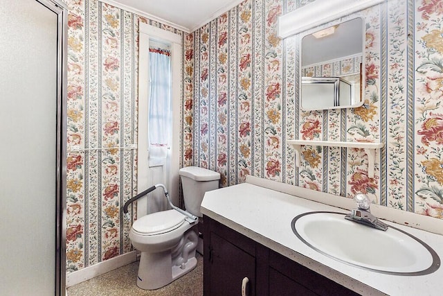 bathroom featuring toilet, baseboards, vanity, wallpapered walls, and ornamental molding