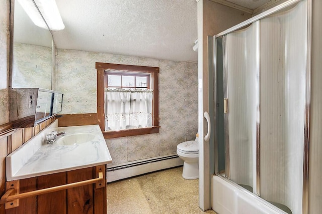 bathroom with a baseboard radiator, toilet, vanity, and a textured ceiling