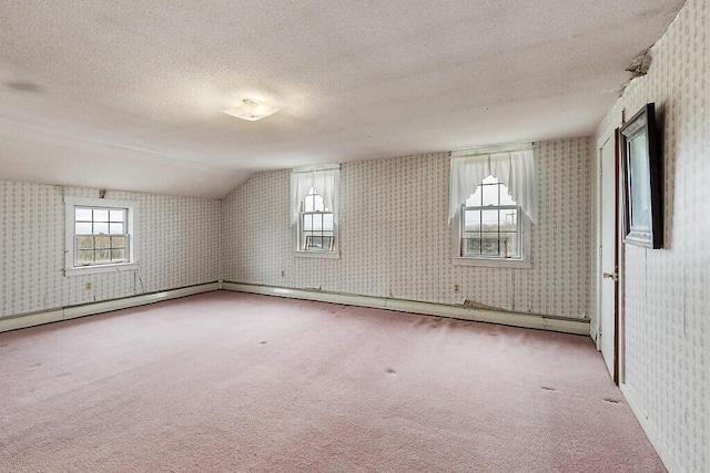 bonus room featuring wallpapered walls, carpet flooring, a textured ceiling, and vaulted ceiling