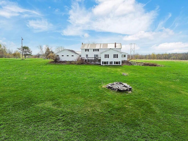 back of house with a yard