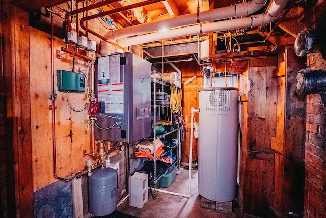 utility room featuring water heater