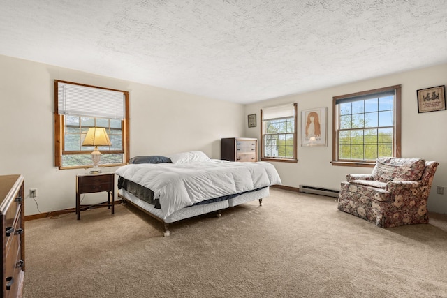 28 Ridgewood Dr, Eliot, ME 03903 - bedroom featuring baseboard heating, carpet, a textured ceiling, and baseboards