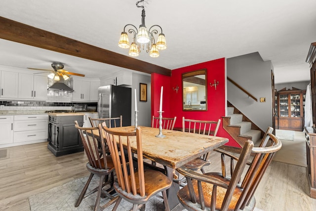 28 Ridgewood Dr, Eliot, ME 03903 - dining area featuring ceiling fan, a chandelier, light wood-style flooring, stairs, and beamed ceiling