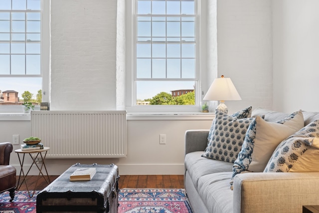 2 Main St Unit 17-410, Biddeford, ME 04005 - living area with radiator heating unit, baseboards, and wood finished floors