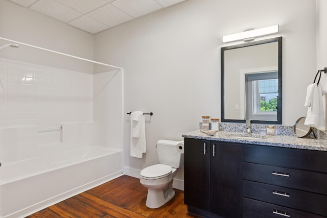 2 Main St Unit 17-410, Biddeford, ME 04005 - bathroom with toilet, wood finished floors, washtub / shower combination, vanity, and baseboards