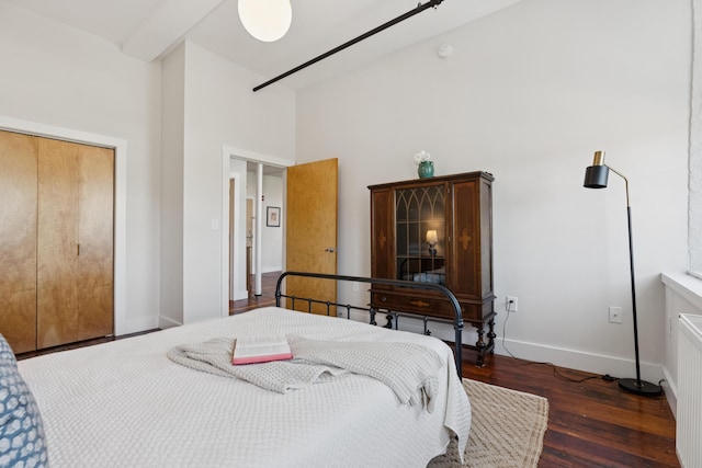 2 Main St Unit 17-410, Biddeford, ME 04005 - bedroom with wood finished floors, a towering ceiling, and baseboards