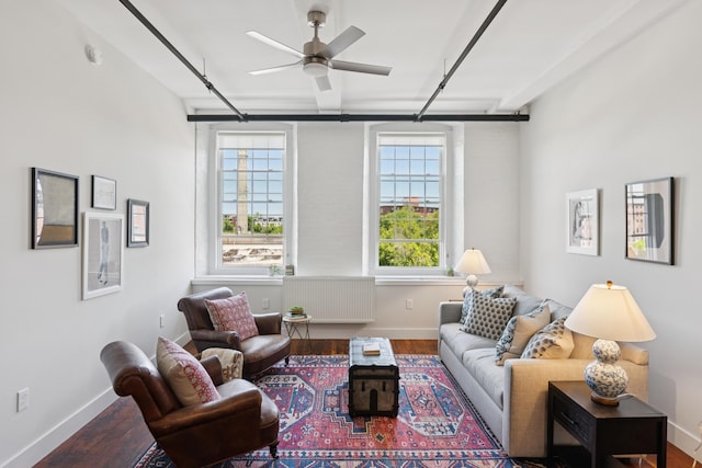 2 Main St Unit 17-410, Biddeford, ME 04005 - living area featuring plenty of natural light, wood finished floors, ceiling fan, and baseboards