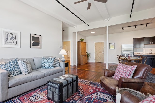 2 Main St Unit 17-410, Biddeford, ME 04005 - living room featuring dark wood-style floors, ceiling fan, rail lighting, and baseboards