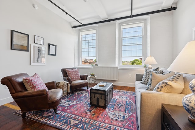 2 Main St Unit 17-410, Biddeford, ME 04005 - living room featuring wood-type flooring, plenty of natural light, baseboards, and beam ceiling